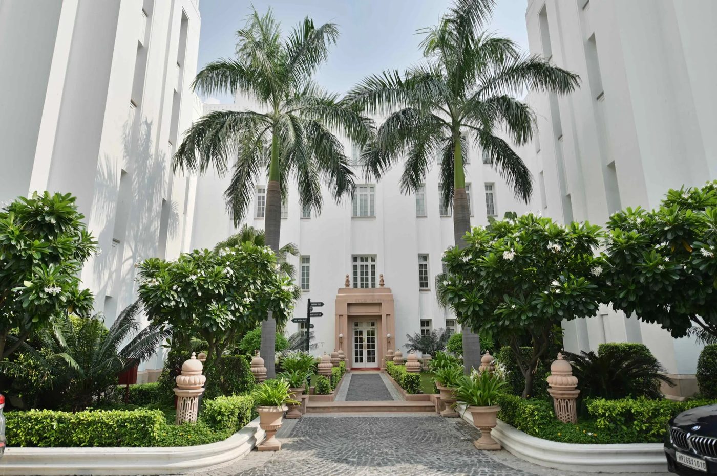 Delhi and The Palace - white colonnades and palm gardens in Lutyens Delhi